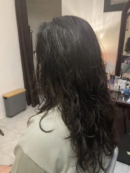 Korean men's hairstyle combining shaved sides with long straight length
