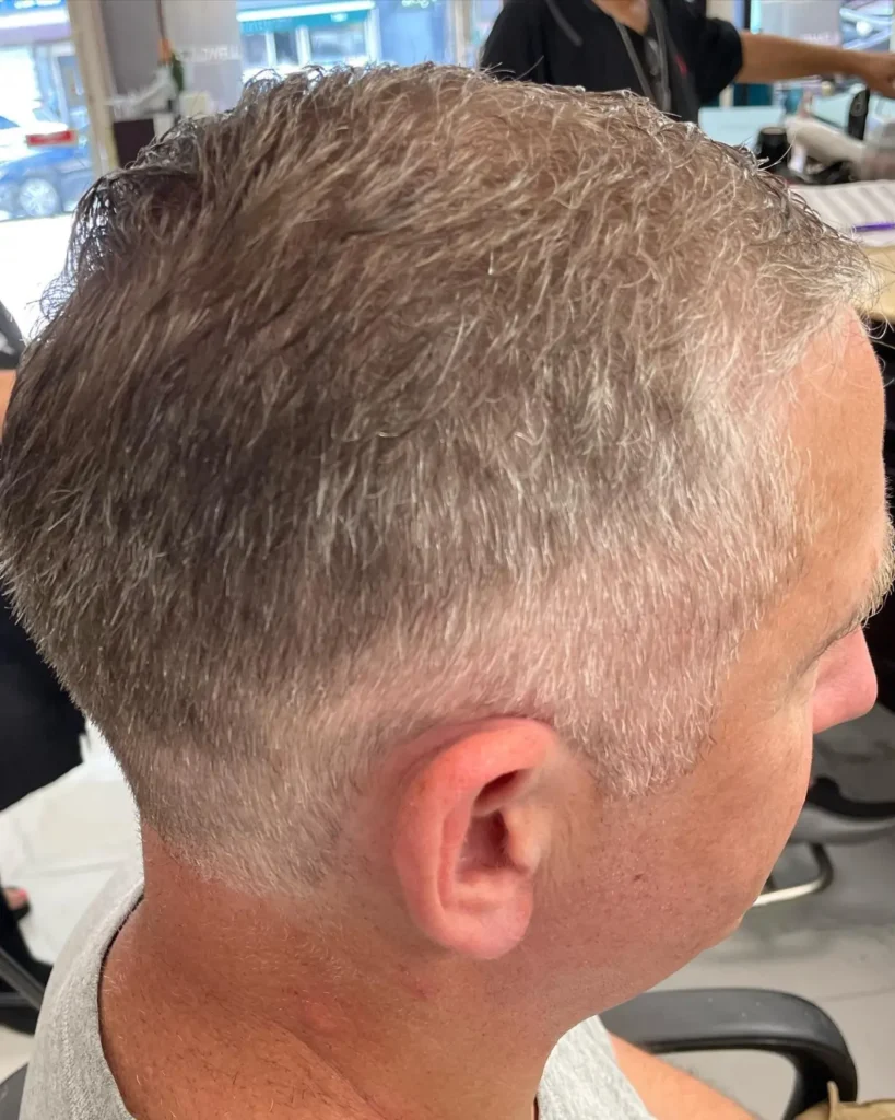 Men's textured haircut styled with natural flow and piece-y separation