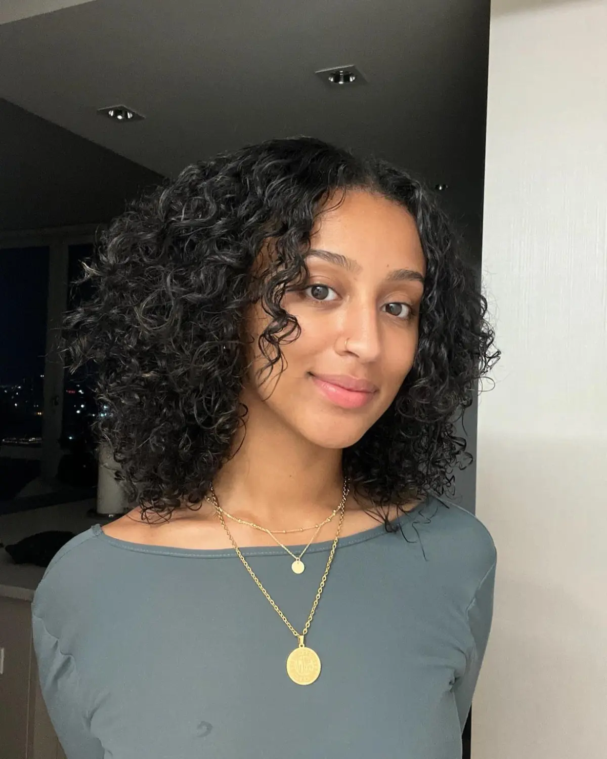 Layered curly haircut with soft face-framing at Seoul Scissors, Brooklyn