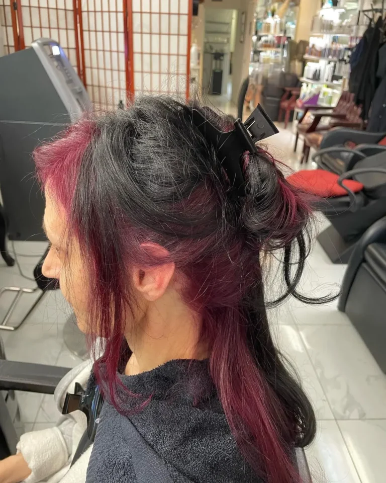 Vivid pastel pink and lavender hair color blended seamlessly into a dark root