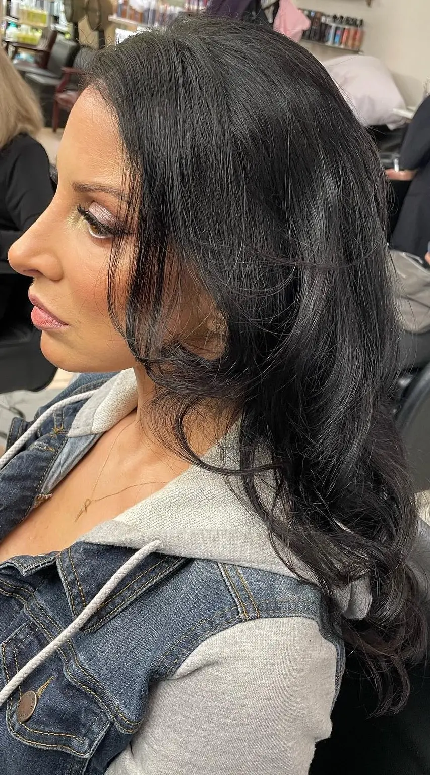 Smooth, glossy brown hair reflecting a high-shine clear glaze treatment
