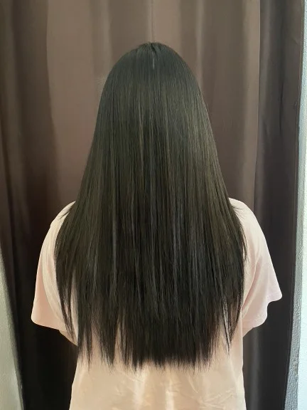 Smooth, pin-straight hair viewed from the back after a Japanese straightening treatment