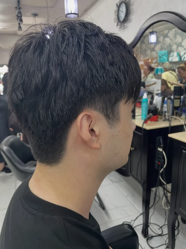 Men's Korean dandy cut with neatly styled top and softly tapered sides