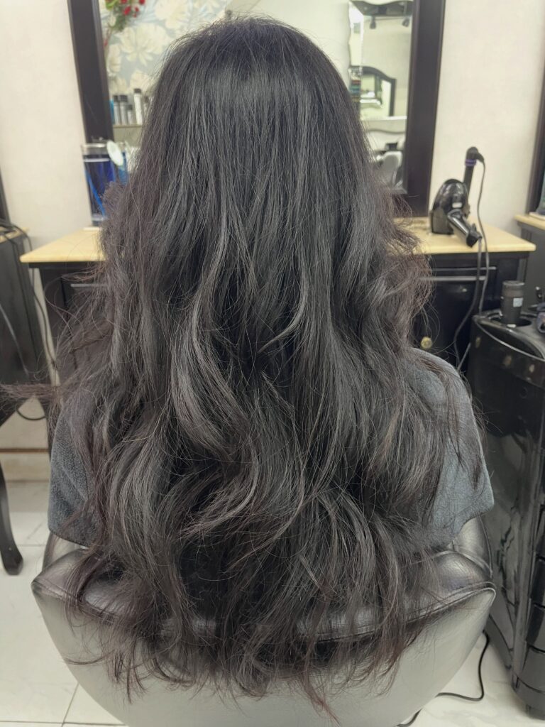 Korean iron perm: textured S-waves swept back with root volume.