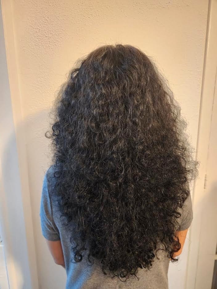 Woman with soft, bouncy Korean perm waves, styled at Seoul Scissors in Brooklyn.
