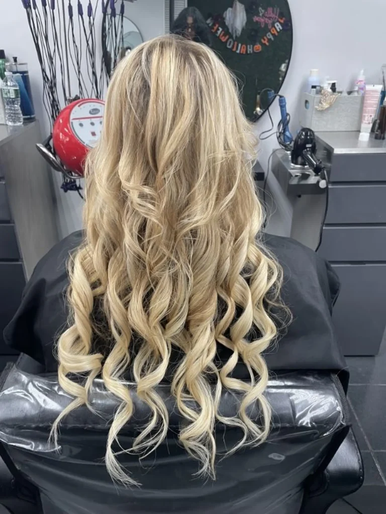 Elegant special occasion hairstyle showcasing polished styling, suitable for weddings, galas, or formal events, with refined texture and a clean finished look.